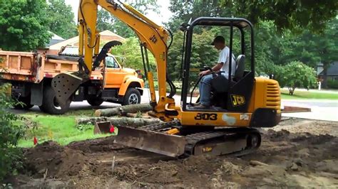 grading with a mini excavator